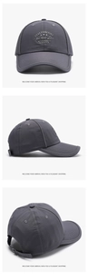 Detail view showing stay positive embroidery and adjustable metal buckle on dark grey cap