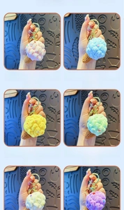 Detailed macro view of colorful plush crochet ice cream keychains with gold metal rings