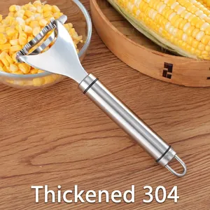 Heavy duty 304 stainless steel corn peeler tool with ergonomic handle on wooden background