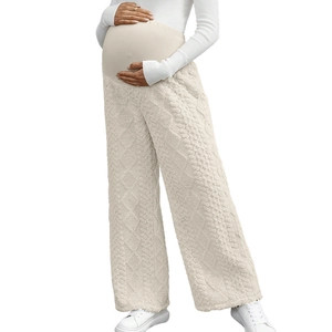 Detailed knit texture of maternity wide leg pants with comfortable high waist support