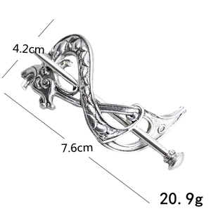Detail view of vintage silver dragon hair clip with size dimensions 7.6cm by 4.2cm