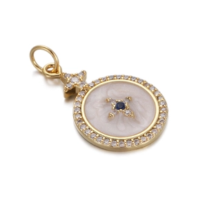 Detailed view of a gold Evil Eye pendant with clear crystals and a blue center stone