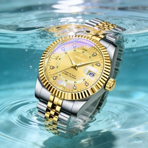 Waterproof detail of two-tone steel watch with gold dial and roman numerals in water