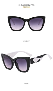 Detail of cat-eye sunglasses featuring black frames and black-white geometric temples