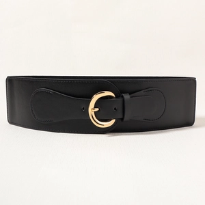 Detail of a black wide corset belt featuring a high-quality leather strap and gold C-buckle