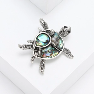 Retro turtle brooch with abalone shell inlay and dark rhinestones in silver finish