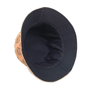Detail of reversible bucket hat with orange cartoon bear print and dark navy solid side