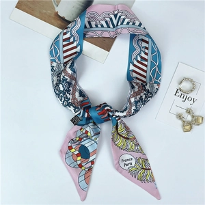 Detail of multi-color ethnic style silk twilly scarf with feather and geometric patterns