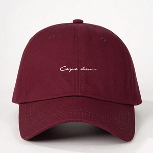 Detailed embroidery of Carpe Diem text on dark red cotton twill baseball cap