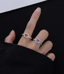 Detail of s925 silver 14k gold plated ring with pink gemstone and micro-pave diamonds