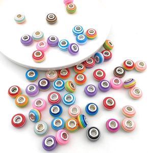 Close-up of colorful striped resin large-hole beads for DIY charm bracelet making