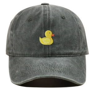 Detailed view of yellow duck embroidery on vintage washed cotton baseball cap