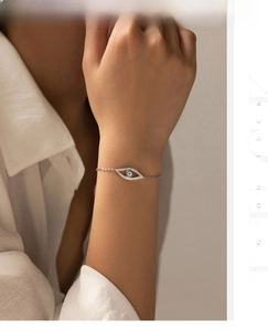 Detail of S925 sterling silver evil eye bracelet with blue stone and white zircons