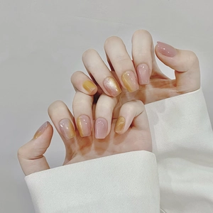 Pink and glitter yellow cat-eye press-on nails with a jelly texture and square shape