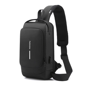 Detail view of water-resistant men's chest bag with integrated USB port and fashion text