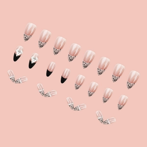 French leopard print press-on nails with 3D heart rhinestones and almond shape design