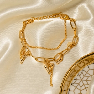 Double-layered 18K gold plated stainless steel bracelet with heart pendant on satin