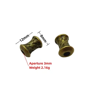 Detailed macro of vintage bronze spacer beads with intricate woven texture for DIY jewelry