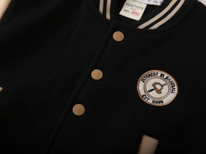Close-up of vintage varsity jacket embroidery and warm thick fabric texture