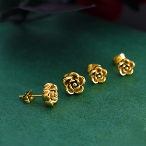French vintage gold rose earrings with textured metal petals and elegant 3D design