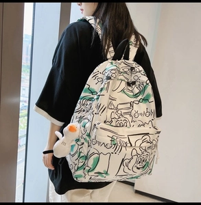 Graffiti print waterproof backpack for students showing spacious interior and side view