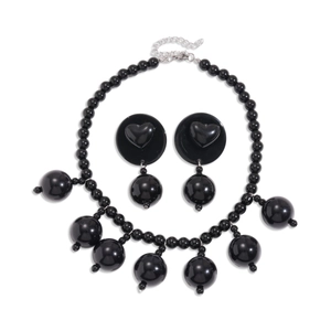 Exaggerated black acrylic beaded necklace and heart earring set for a gothic statement
