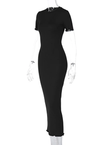 Detail view of the fine ribbed knit texture on a black slim-fit maxi dress