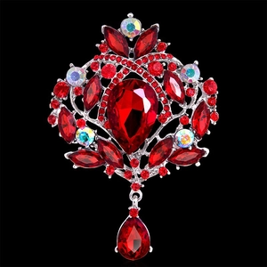 Baroque silver brooch with large red pear-shaped rhinestones and luxury crystal accents