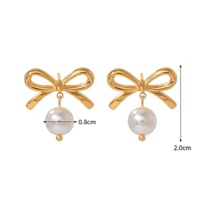 Detailed view of 18K gold bow earrings with 0.8cm pearls showing 2.0cm total height