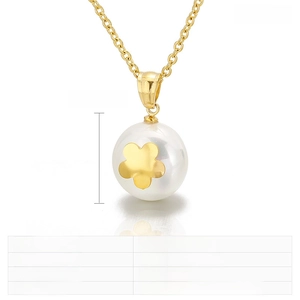 Detail of 16mm pearl shell pendant on gold stainless steel chain weighing 5 grams