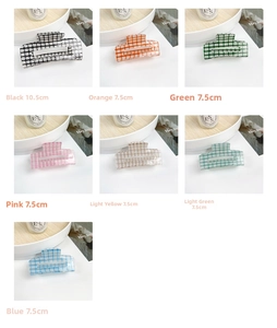 Close-up of checkerboard acrylic hair claws in assorted colors and multiple sizes