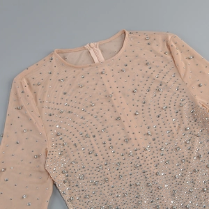 Detailed view of nude mesh dress with sparkling silver rhinestones and hidden back zipper