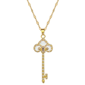 Gold key necklace with white enamel clover head and shimmering crystals for women