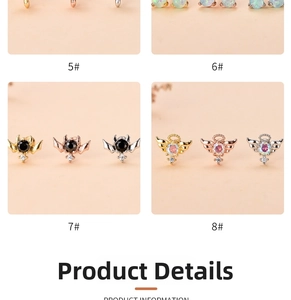 Detailed close-up of zircon heart and star cartilage studs in gold and silver finishes