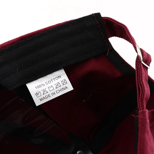 Detail view of cotton baseball cap inner tag with 100% cotton material label