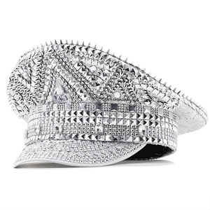 Detailed view of silver sequin captain hat with sparkling rhinestones and metallic spikes