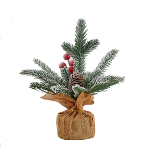 Mini artificial Christmas tree with snow, red berries, pinecones and burlap base