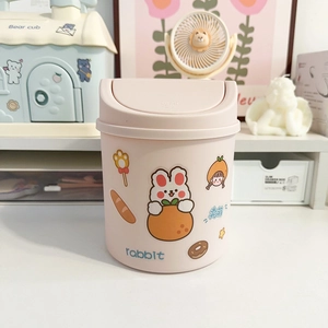 Pink mini desktop trash can with cute rabbit stickers and press-top lid for office use