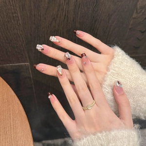 Handmade French Christmas press-on nails with brown tones, rhinestones and pearls