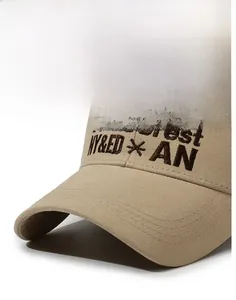 Detailed close-up of khaki cotton baseball cap with dark brown PineCrest embroidery