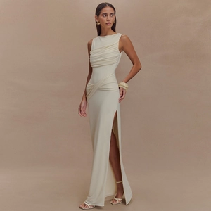 Detail of elegant off-white sleeveless maxi dress with side slit and pleated texture