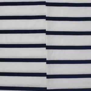 Detailed close-up of blue and white striped knit fabric with precise seam alignment