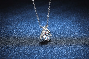 Macro shot of 1 carat moissanite pendant with micro-pave setting on a silver chain