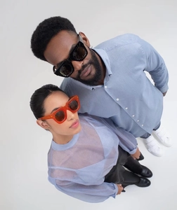 Close-up of stylish square sunglasses in black and amber orange high-quality frames