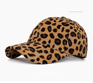 Detail of corduroy baseball cap showing fabric texture and khaki leopard print