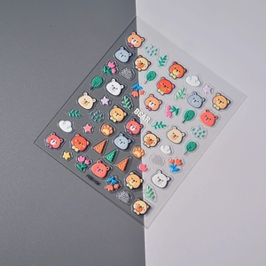 Macro shot of 5D embossed nail art stickers with 3D kawaii bears and floral details