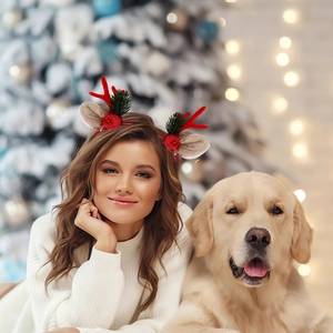 Close-up of reindeer antler hair clips worn by a model in a warm festive Christmas scene