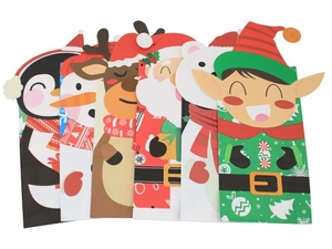 Detail of Christmas themed paper gift bags with colorful penguin and reindeer cartoon designs