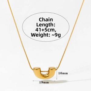 Detailed view of the gold U-shaped pendant with precise dimensions and weight