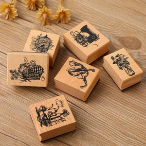 Set of six vintage wooden stamps featuring retro birds, cats, and tea time designs